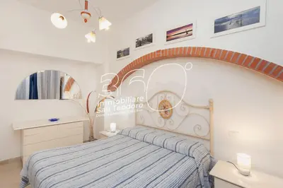 Letto o letti in una camera di Quadri Lu Mulinu