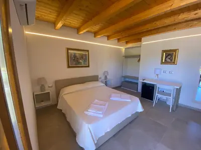 Letto o letti in una camera di B&B Pettirosso