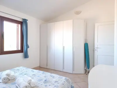 Letto o letti in una camera di Residenza Monte Rena - Rena A3 - Budoni Sweet Home