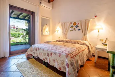 Letto o letti in una camera di Villa Silènis