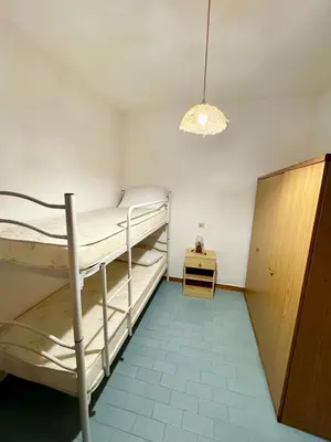 Letto o letti in una camera di Trilocale L&L San Teodoro