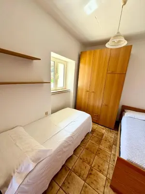 Letto o letti in una camera di Trilocale L&L San Teodoro