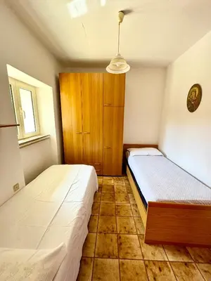 Letto o letti in una camera di Trilocale L&L San Teodoro