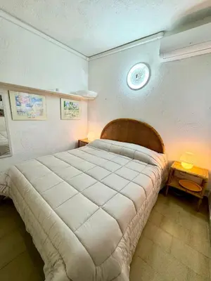Letto o letti in una camera di Bilocale a 300mt dalla spiaggia La Cinta