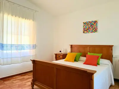 Letto o letti in una camera di Il Glicine - Appartamenti a 4 chilometri dal mare di Orosei