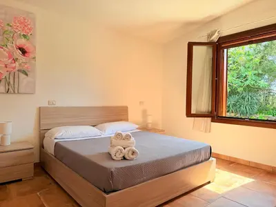 Letto o letti in una camera di Il Glicine - Appartamenti a 4 chilometri dal mare di Orosei
