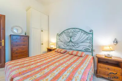 Letto o letti in una camera di Casa Alfredo - By Searly