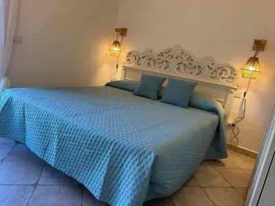 Letto o letti in una camera di Ca' Mirto, una villa vicino a spiagge da sogno