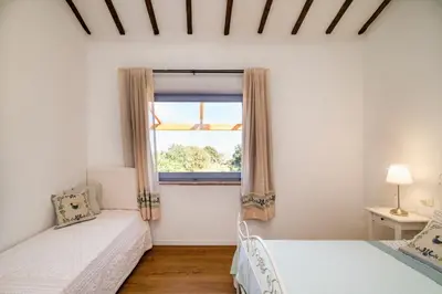 Letto o letti in una camera di Stazzu Straetu antico stazzo Gallurese con vista sul Golfo di Olbia