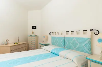 Letto o letti in una camera di Villa with Pool overlooking Tavolara - Porto San Paolo