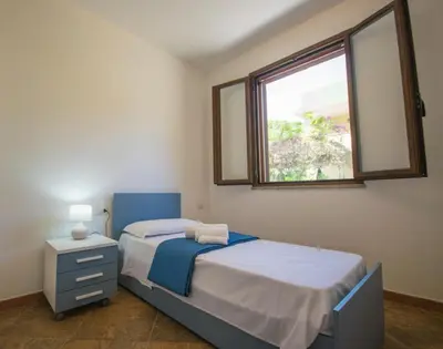 Letto o letti in una camera di EVH Residence San Giovanni