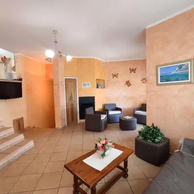 Area soggiorno di Belvedere Apartment Ac, Budoni