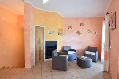 Area soggiorno di Belvedere Apartment Ac, Budoni