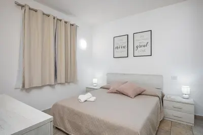 Letto o letti in una camera di Casa Vacanze Lo Squalo