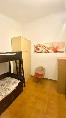 Letto o letti in una camera di casa spiaggia San Teodoro