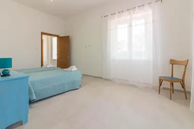 Letto o letti in una camera di GuestHost Peaceful stay in Berchiddeddu with garden