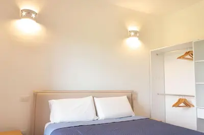 Letto o letti in una camera di Bilocale tra terra e mare