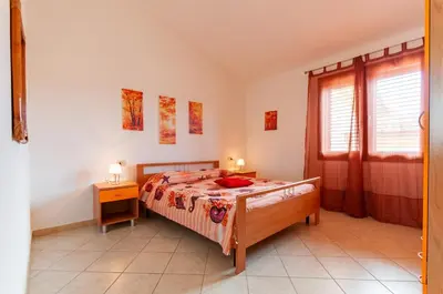 Letto o letti in una camera di Appartamento Fabio Caletta sul mare