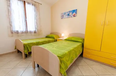 Letto o letti in una camera di Appartamento Fabio Caletta sul mare