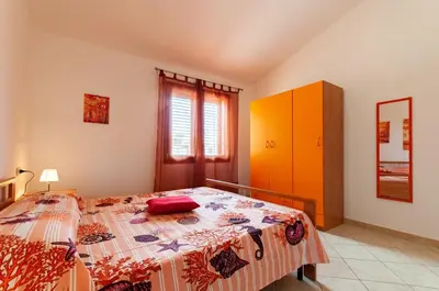 Letto o letti in una camera di Appartamento Fabio Caletta sul mare