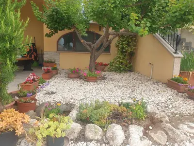 Giardino di Appartamento Pina Caletta sul mare