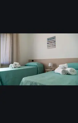Letto o letti in una camera di Appartamento Maria Giovanna Caletta sul mare