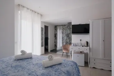 Letto o letti in una camera di BED INN - Palazzo Urbe