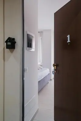 Letto o letti in una camera di BED INN - Palazzo Urbe