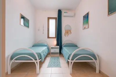 Letto o letti in una camera di Giobo Mare