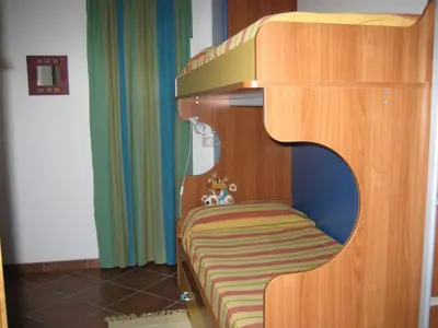 Letto o letti in una camera di Casa vacanze a 50 m dal mare