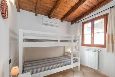 Letto o letti in una camera di Gli Allori - Happy Rentals