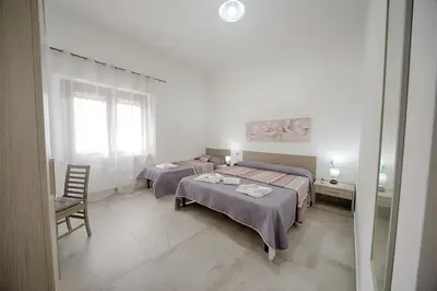 Letto o letti in una camera di Casa Lucia
