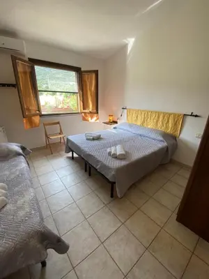 Letto o letti in una camera di Affitta Camere L'Oleandro