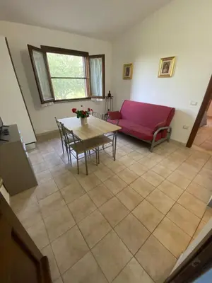 Area soggiorno di Affitta Camere L'Oleandro