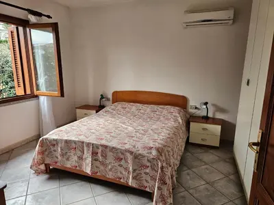 Letto o letti in una camera di Casa Corallo