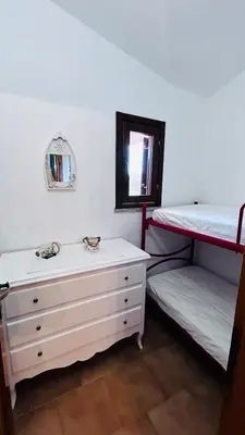 Letto o letti in una camera di Casa MARCO Villaggio Le mandorle