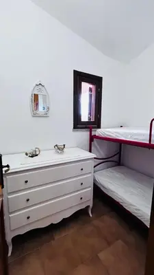 Letto o letti in una camera di Casa MARCO Villaggio Le mandorle