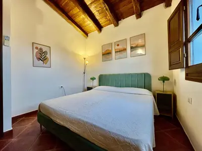 Letto o letti in una camera di Villetta Felicità SAN TEODORO