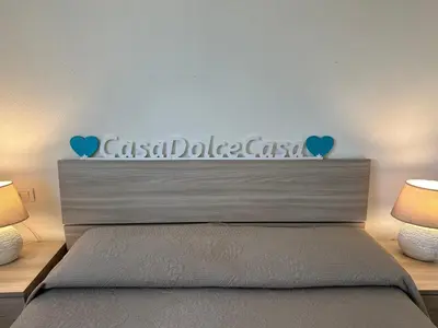 Letto o letti in una camera di Casa Dolce Casa - con piscina a un passo dal mare
