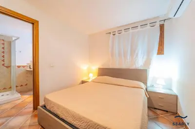 Letto o letti in una camera di Villa Filomena - By Searly