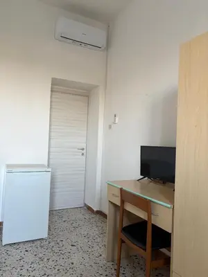 TV o dispositivi per l'intrattenimento presso Affittacamere Belvedere - Posada