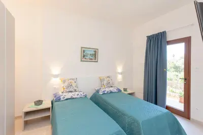 Letto o letti in una camera di Domo Davide