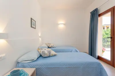 Letto o letti in una camera di Domo Davide