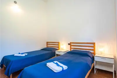 Letto o letti in una camera di La Suara Manna - Happy Rentals