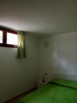 Letto o letti in una camera di Villetta lizzu