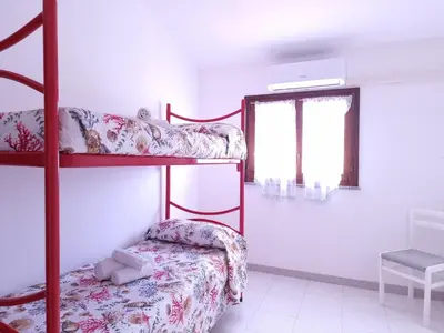 Letto o letti in una camera di Residenze Piras - Budoni Sweet Home