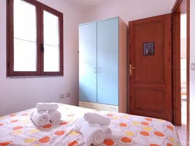 Letto o letti in una camera di Residenze Solemar