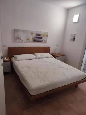 Letto o letti in una camera di Baia Caddinas, Golfo Aranci