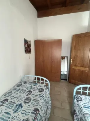 Letto o letti in una camera di Villetta Rinaggiu