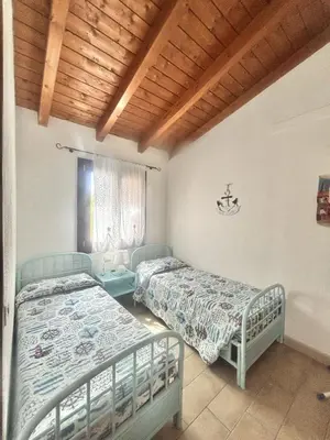 Letto o letti in una camera di Villetta Rinaggiu